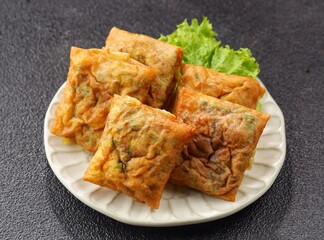Martabak Telur. Mini egg martabak is a snack made from eggs. Its delicious taste and mini shape make it suitable for serving as a family snack.