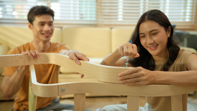 Photo series of young asian couple assembly a new furniture at home - Powered by Adobe