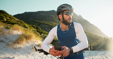 Fitness, cyclist and man with cellphone in nature for networking, chatting or connectivity with training. Sports, cycling and athlete with phone for texting, communication or contact on mobile app.