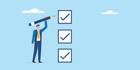 Businessman completing a checklist with a pencil