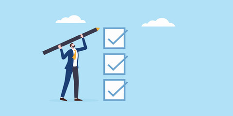 Man completing checklist with giant pencil