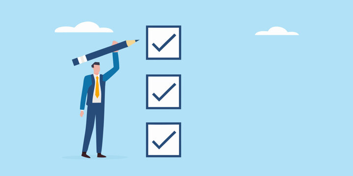 Businessman completing a checklist with a pencil