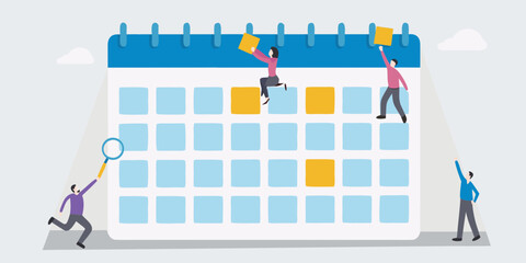 People planning and organizing tasks on a large calendar