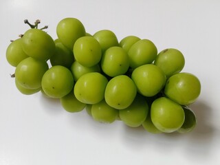 green grapes. close-up of fresh green grapes on white background.