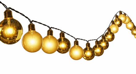 Warm glowing vintage edison style light bulbs strung on a dark background creating a festive atmosphere