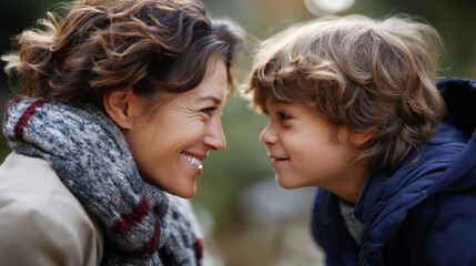 Obraz premium Individual and young youngster share warm moment outdoors faceless pair defocused natural background smiling at each other scene parent child connection visualization family