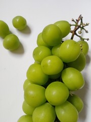 green grapes. close-up of fresh green grapes on white background.