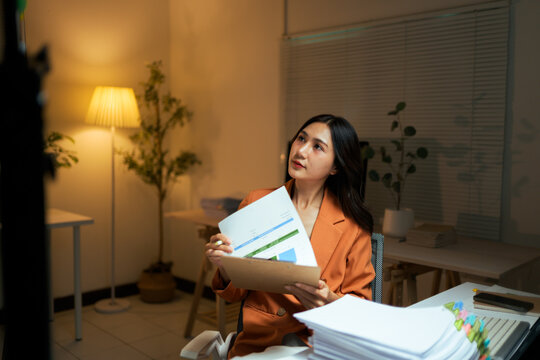 Asian businesswoman analyzing data preparing for presentation