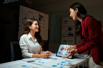 Fototapeta premium Businesswomen analyzing data together during office meeting