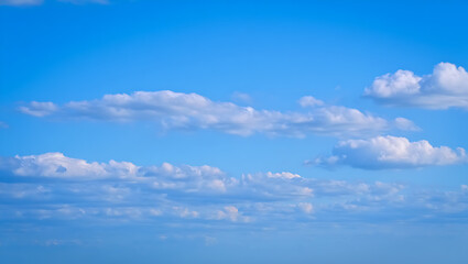 Obraz premium Blue sky with soft white clouds in a bright clear day