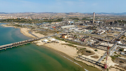 Aerial view of the industrial area of ​​Gela, in the province of Caltanissetta, Sicily, Italy. It is a large industrial complex located on the Mediterranean coast. In background is the city of Gela.