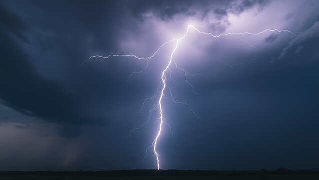 ionization. Dramatic inverted Y-shaped lightning against a stormy sky with long exposure effect. ESG reports, sustainability campaigns, designed for sustainability communications and ESG reporting.