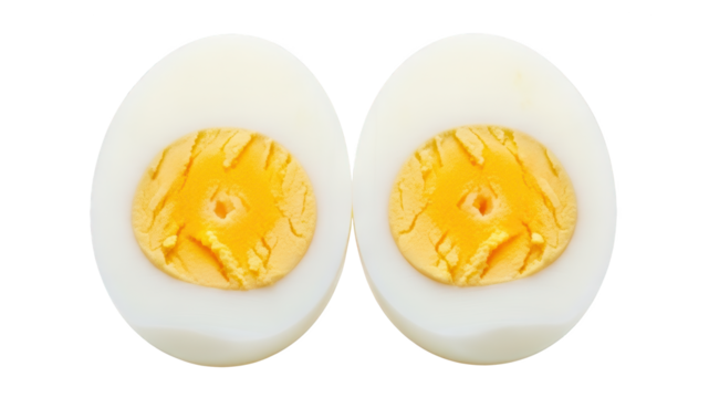 Two halves of a single hard boiled egg displayed side by side against a dark background