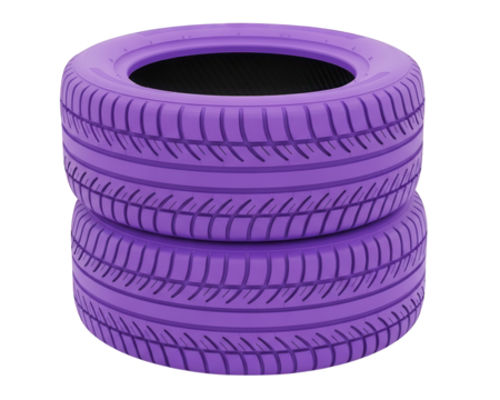 Two vividly colored automotive tires are stacked vertically against a background of abstract light streaks