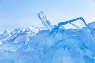Scenic winter landscape of frozen Baikal Lake. Natural background with pile of clear blue ice on cold winter day. Conceptualizing the world's fresh water reserves. Winter ice backdrop