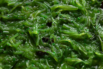 Food background fermented kelp sliced seaweed salad close up