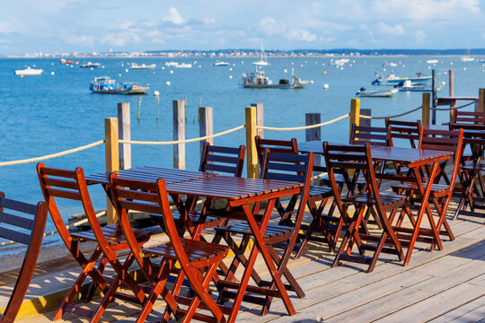 restaurant table by the sea and port