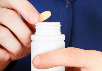 Person take a Pill closeup