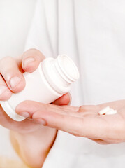 Person take a Pill closeup