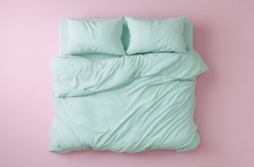 Mint green bed linens on a pink floor