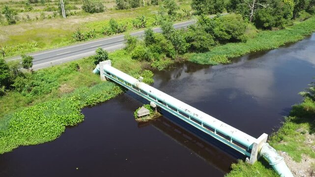 Large pipes supplying clean water that cross the river