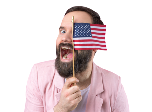 Portrait of a satisfied young man with a beard with an American flag on a red studio background. Great US patriot and defender of freedom.