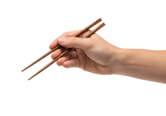 Human hand holding wooden chopsticks isolated on transparent background