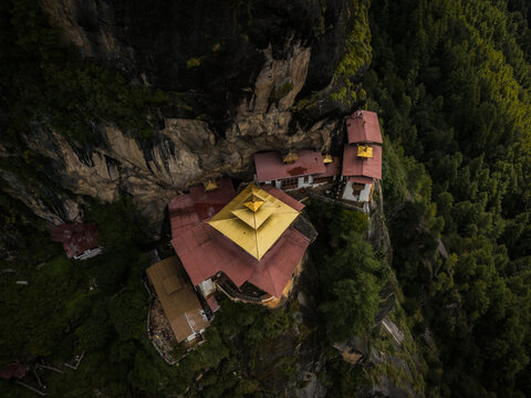 Aerial view of the iconic Tigers Nest Monastery perched dramatically on a cliffside, a testament to faith and architecture, Paro, Bhutan.
