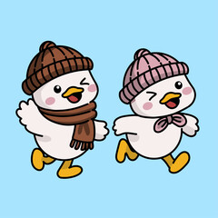 Two baby ducks wearing winter clothes walking happily in cold weather.