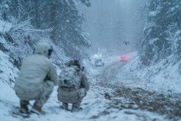 Fototapeta premium A gripping portrayal of tactical personnel conducting covert operations in a blinding snowstorm, reflecting determination and resilience amidst adverse weather conditions.