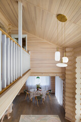 Internal balcony. Mezzanine floor in a log house.