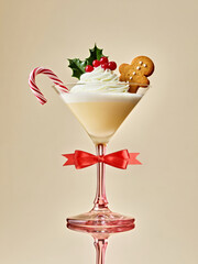 Christmas Cocktail. Festive Eggnog Martini with Candy Cane and Gingerbread in Elegant Glass for Holiday Celebrations