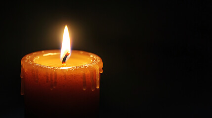 Warm candlelight glows in the darkness, creating a peaceful and serene mood