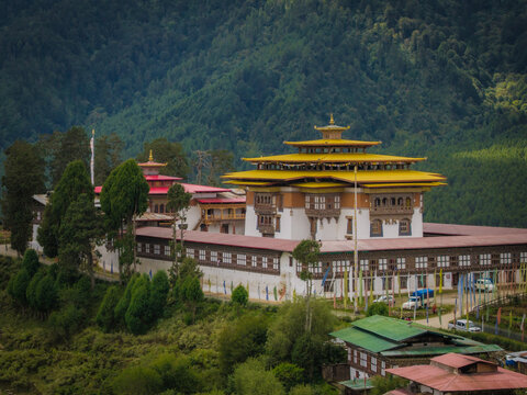 Aerial view of the golden-roofed Gangtey Monastery standing majestically against the backdrop of the lush green Phobjikha Valley, Gangtey village, Wangdue Phodrang, Bhutan.