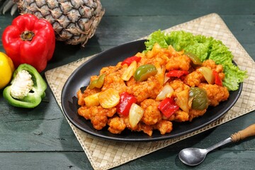 Ayam Asam Manis. Sweet and sour chicken is a Cantonese specialty often found on Chinese restaurant menus.
