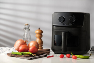 Air Fryer with Fresh vegetables Ingredients.