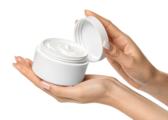 hand holding an open white jar of cosmetic face cream isolated on a transparent background.