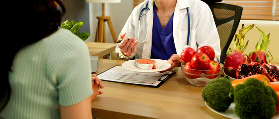 The healthcare professional providing nutritional guidance to a patient, developing healthy diet, dietary program. \