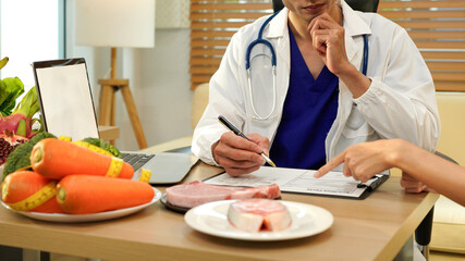 The healthcare professional providing nutritional guidance to a patient, developing healthy diet, dietary program. \