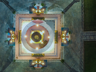 Aerial view of the Memorial Chorten radiates a golden glow against the cool night, its intricate design a beacon of peace, Thimphu, Bhutan.