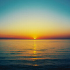 Naklejka premium Colorful ocean sunset casting warm reflections across calm water surface