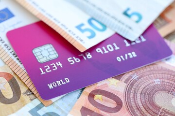 Euro money bills banknotes and credit card for cashless payments. Concept of banking service in European Union countries