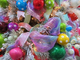 colorful fun decorations of a whire christmas tree up-close