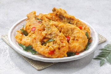 Udang Telur Asin. Salted Egg Prawns is a simple dish made from prawns, salted eggs and curry leaves.