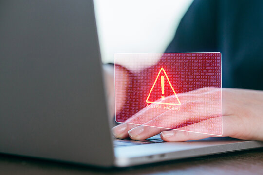 Security alert warning for system compromised during remote work on laptop