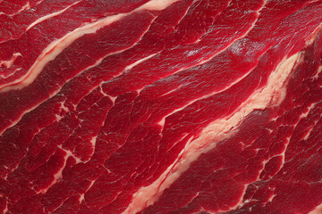 Close-up of fresh red meat displaying rich textures and marbling, ideal for culinary showcases and meat industry visuals.