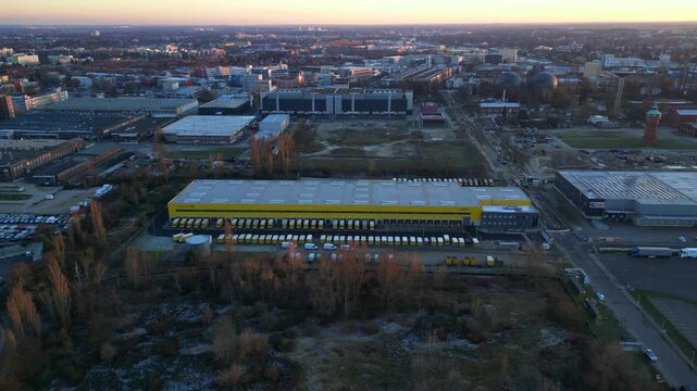 Long yellow DHL distribution center Berlin. Gorgeous aerial view flight drone