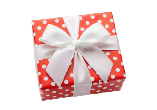 Red gift box with white polka dots and bow isolated PNG, present for Christmas birthday or other holiday on transparent background