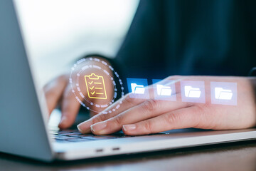 Engaging in digital organization with a laptop and visual file management tools