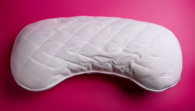 white textured ergonomic pillow with double contour on pink background image photo